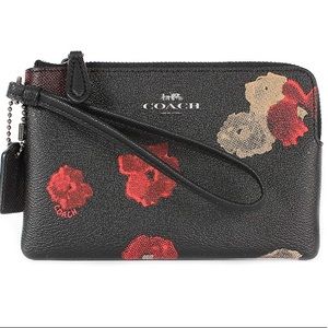 Coach, black floral wristlet